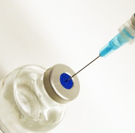syringe and needle in medicine bottle