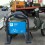 Two prong war on cars: new bike/moped rack, backed by dreaded orange “evakuator” — the now ubiquitous tow truck. VOA Photo: James Brooke