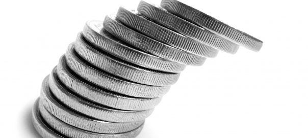 a pile of silver coins tilting to the left