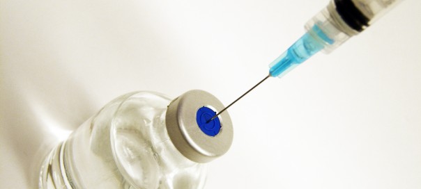 syringe and needle in medicine bottle
